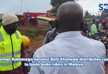 Former Kakamega Senator, Bonnie Khalwale, distributes cash to bodaboda riders in Malaba