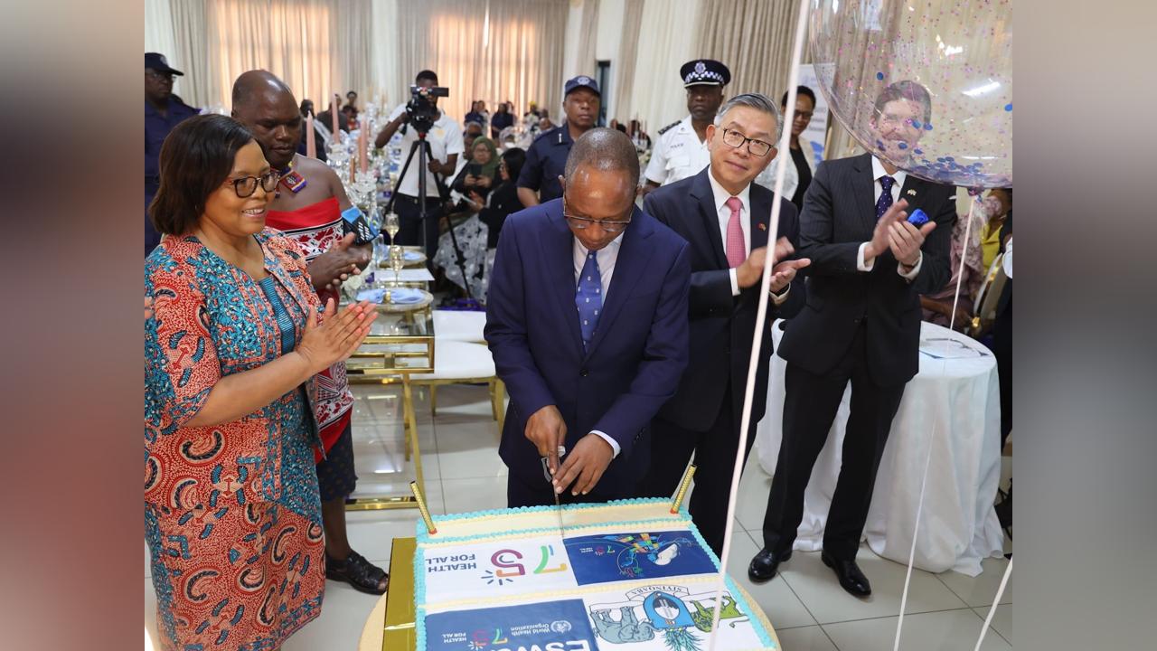 Prime Minister Cleopas Dlamini cuts cake during World Health Organization(WHO) 75th Anniversary Prime Minister Cleopas Dlamini cuts cake during World Health Organization(WHO) 75th Anniversary