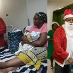 MINISTER BRINGS CHRISTMAS CHEER TO NEWBORN BABIES MINISTER BRINGS CHRISTMAS CHEER TO NEWBORN BABIES