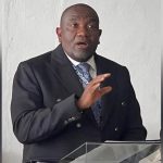 Hughes Returns Urging Unity After Probe Clearance Hughes Returns Urging Unity After Probe Clearance