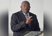 Hughes Returns Urging Unity After Probe Clearance Hughes Returns Urging Unity After Probe Clearance