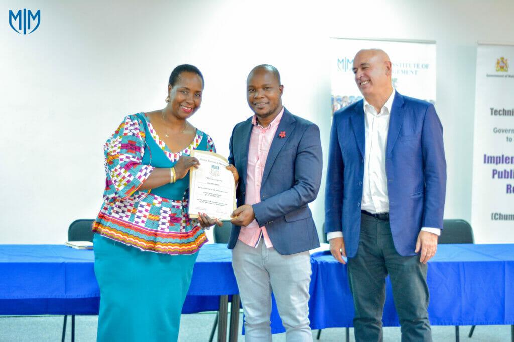 MIM equips 22 public officers in effective financial report writing MIM equips 22 public officers in effective financial report writing