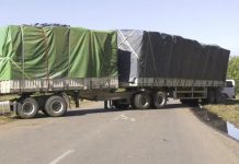 Road blocked after police shoot two drivers in wrong vehicle Road blocked after police shoot two drivers in wrong vehicle