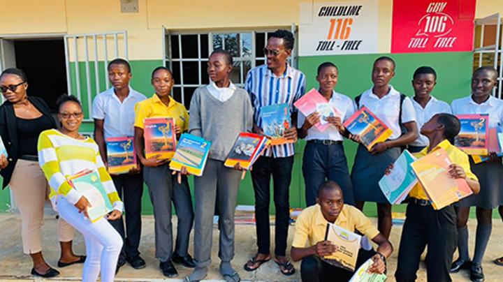 Taking textbooks to the needy Taking textbooks to the needy
