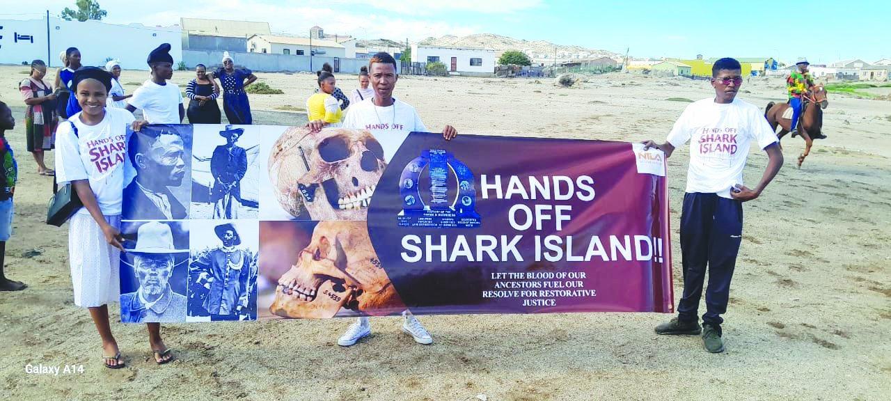 ‘Hands off Shark Island’ ‘Hands off Shark Island’