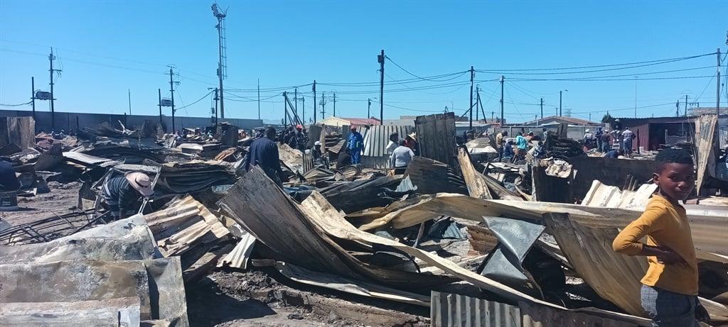 Fire victims scramble to rebuild their lives after blaze tears down more than 100 shacks in Philippi Fire victims scramble to rebuild their lives after blaze tears down more than 100 shacks in Philippi