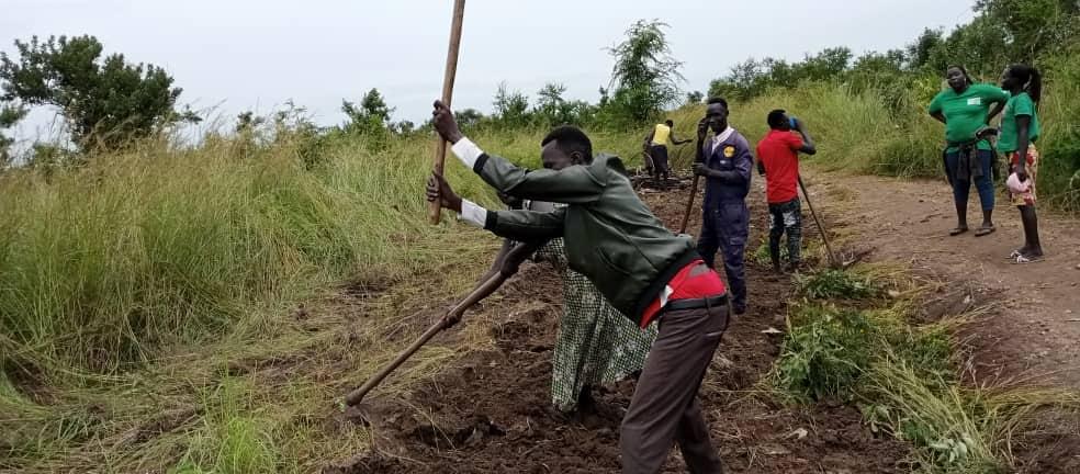 Owinykibul villagers renovate roads with hand tools Owinykibul villagers renovate roads with hand tools