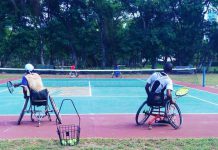 WHEELCHAIR TEAM PLAYERS GET TENNIS BODY SUPPORT