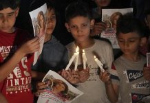 Palestinians attend memorial service for slain journalist Palestinians attend memorial service for slain journalist
