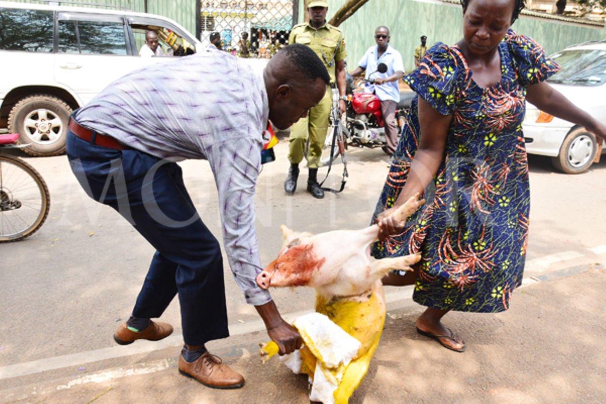 Torture protesters dump painted pig near Parliament Torture protesters dump painted pig near Parliament