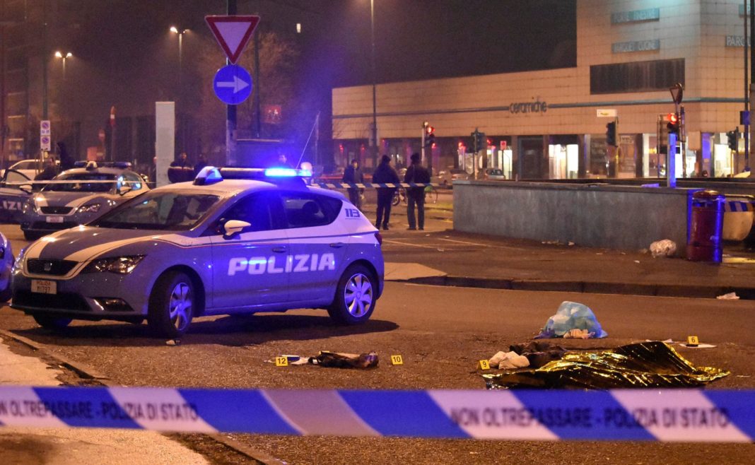 The body of Anis Amri, the suspect in the Berlin Christmas market truck attack, is seen covered by a thermal blanket in a suburb of the northern Italian city of Milan