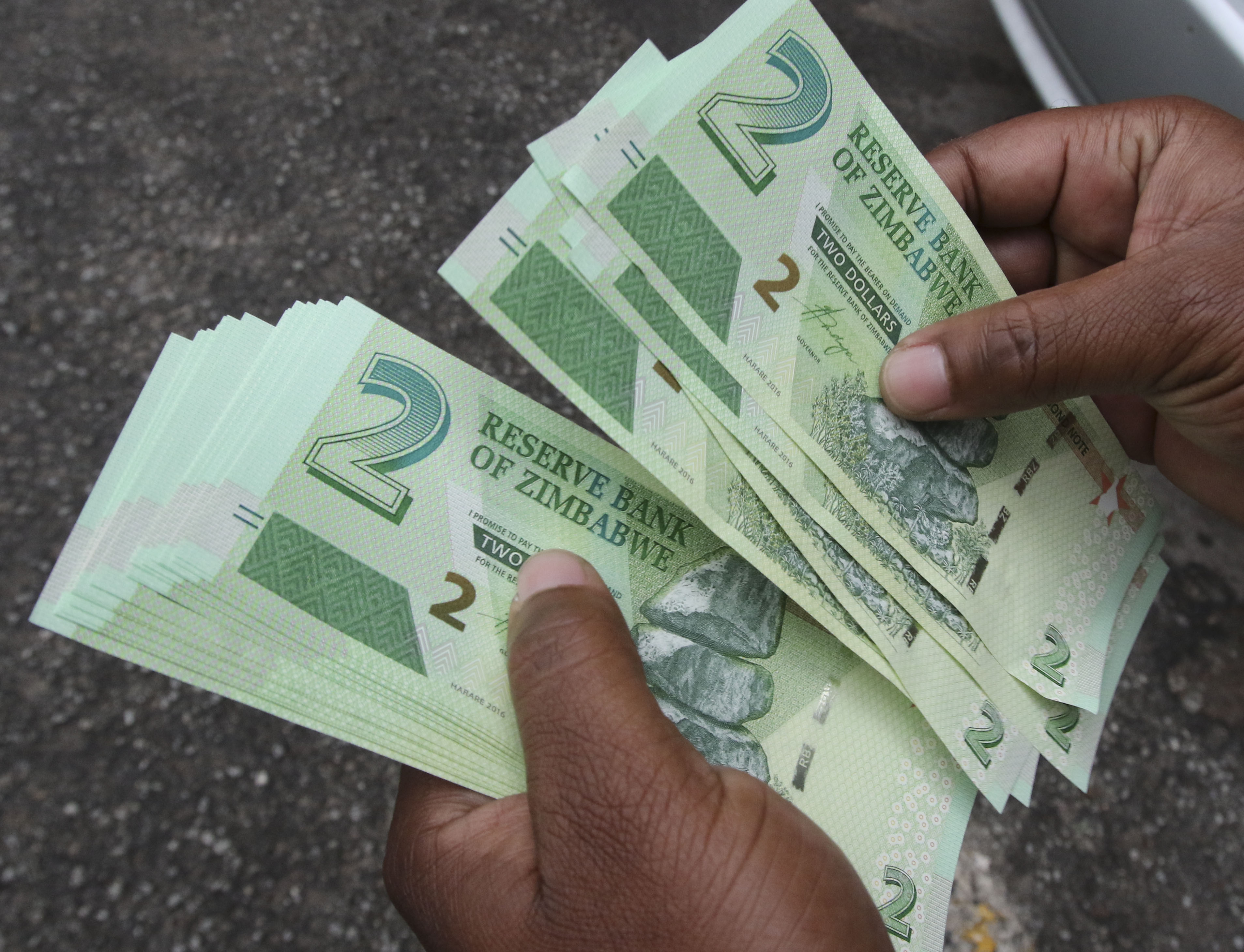 LATEST RBZ abandons 11 exchange rate; floats RTGS currency zimbabwe