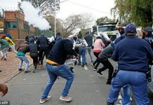 Protesters and S.African police clash at Zimbabwe embassy