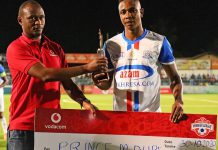 Prince Dube receives his cheque for Player of the Month award