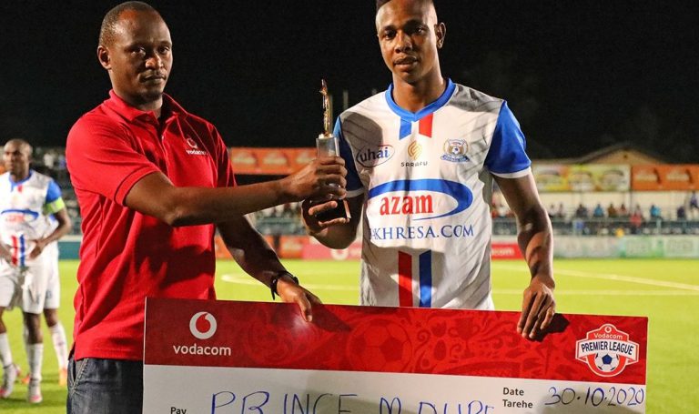 Prince Dube receives his cheque for Player of the Month award